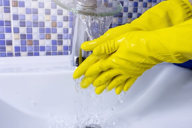 rubber gloves to empty black tank